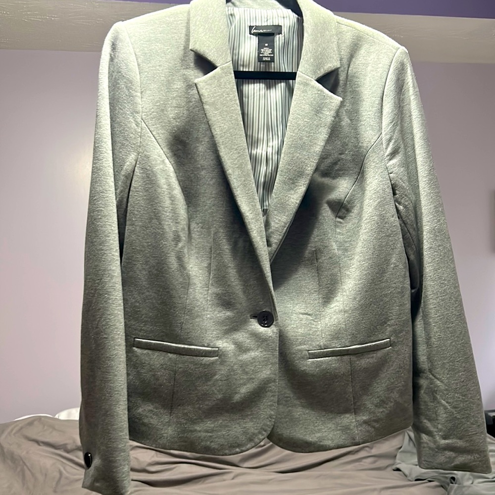 Make your work slacks look more professional by dressing them up.